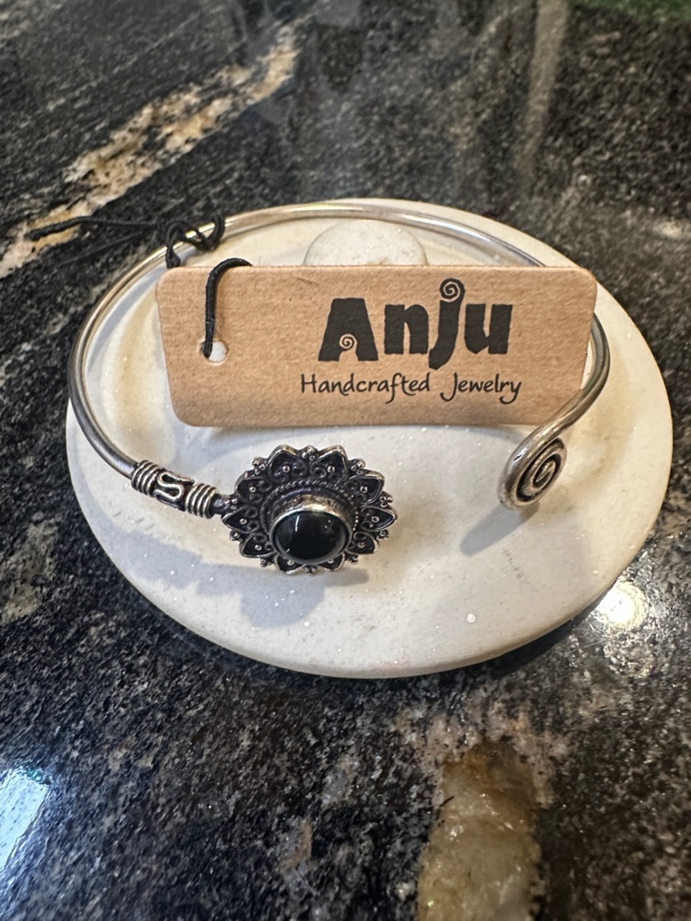 Anju Handcrafted Silver-Tone Bracelet with Black Stone Floral Accent